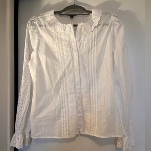 JCrew white eyelet ruffle sleeve/neck button down shirt.